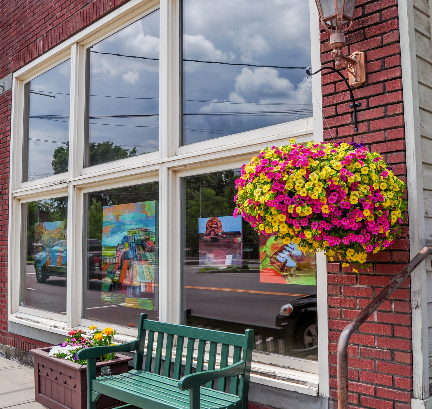 Colorful works of art line the windows in Livingston Manor’s Catskill Art Society, complimented by equally colorful flowers hanging in baskets all along Main Street. Gorgeous!